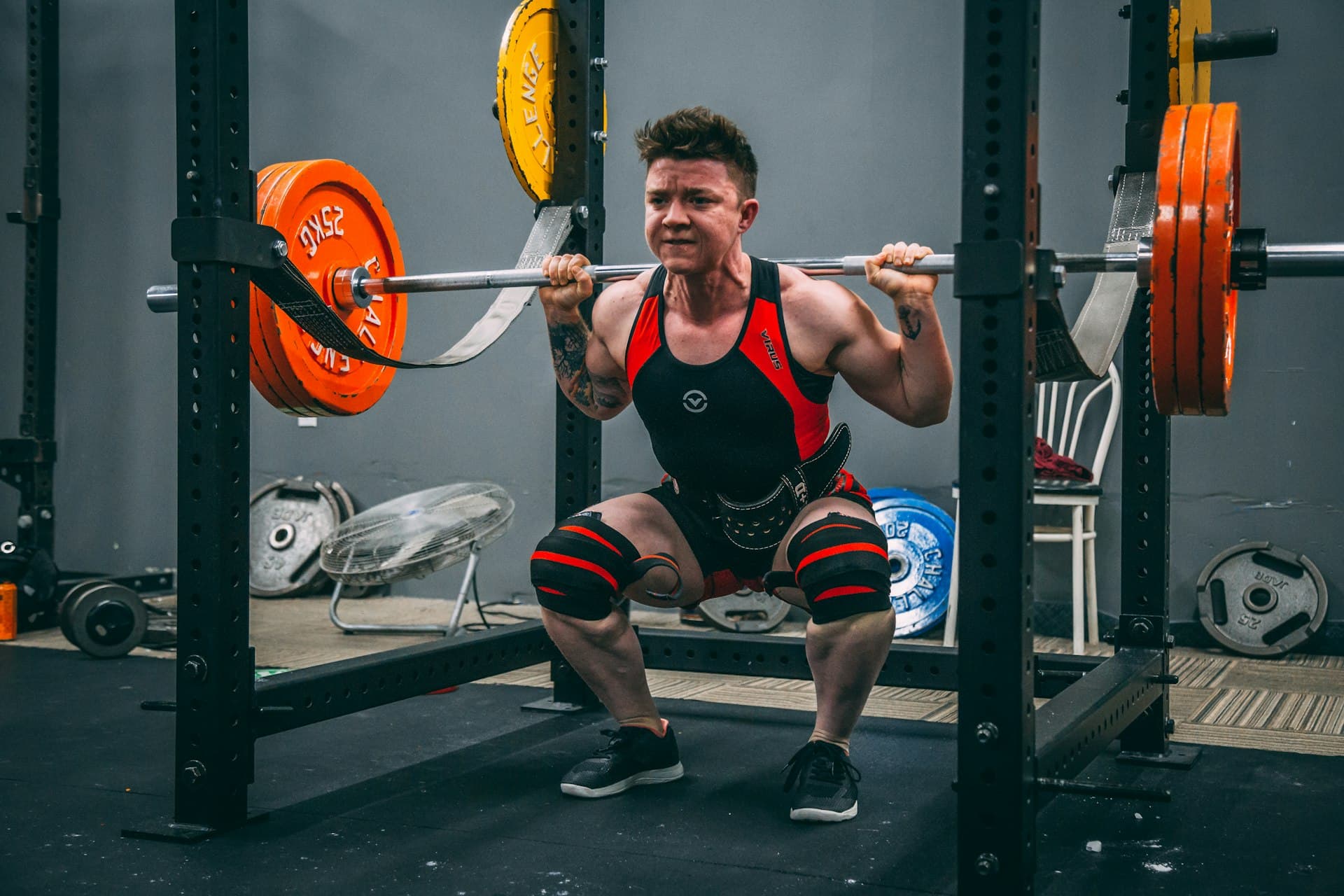 Member weightlifting during a strength training session