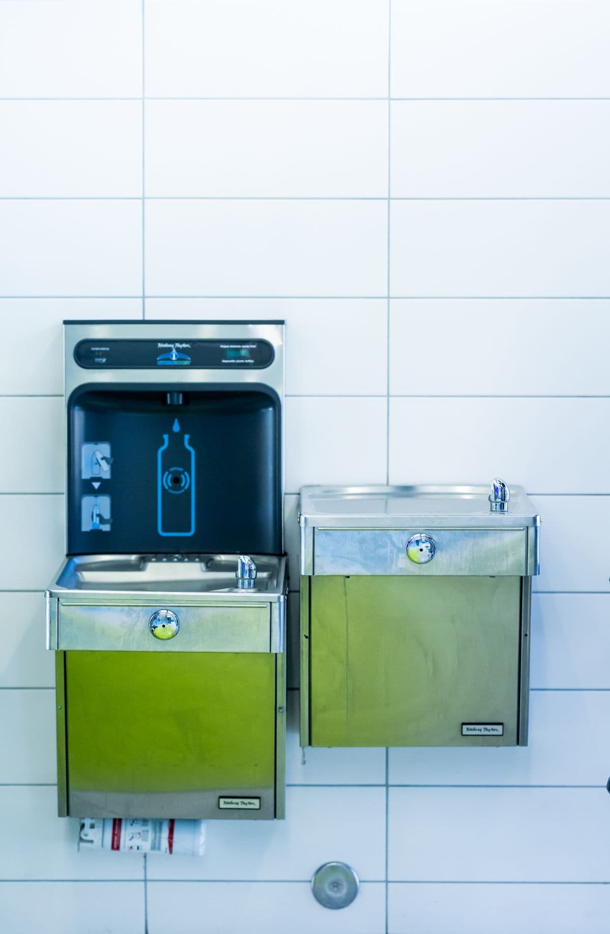 Wall-mounted filtered water fountains with a bottle refill dispenser